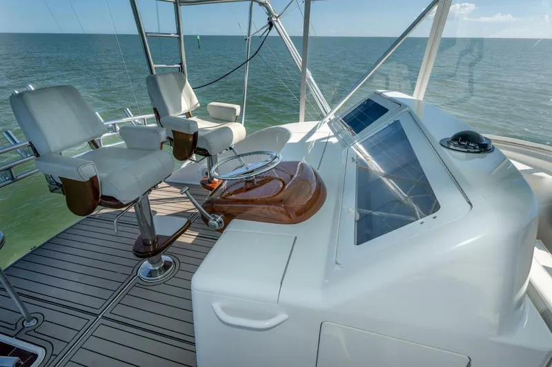 Stay Salty Yacht Photos Pics Helm of 2009 Viking 50 Convertible yacht with ocean view and luxury seating.