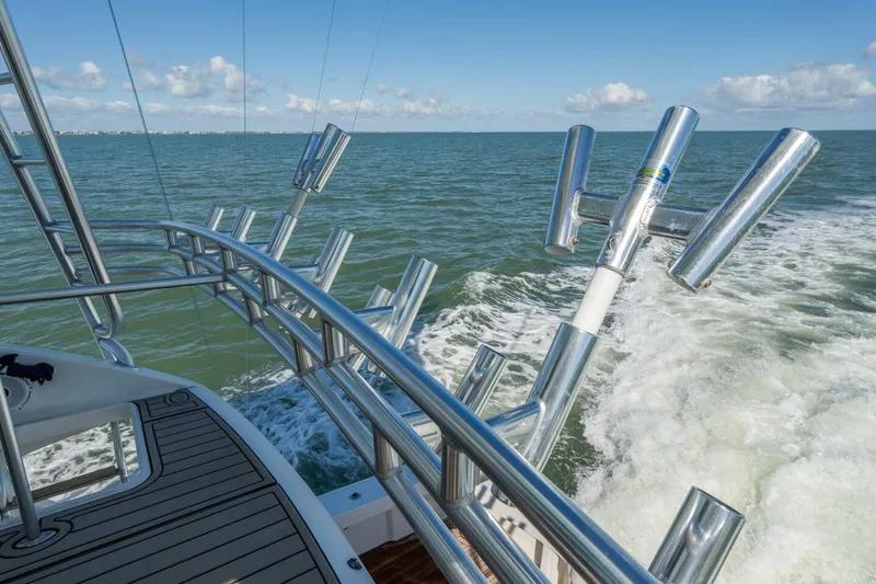 Stay Salty Yacht Photos Pics 2009 Viking 50 Convertible yacht cruising on open water with rod holders.