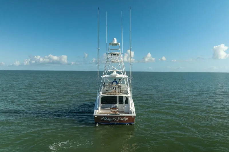 Stay Salty Yacht Photos Pics 2009 Viking 50 Convertible yacht on open sea under clear blue sky.