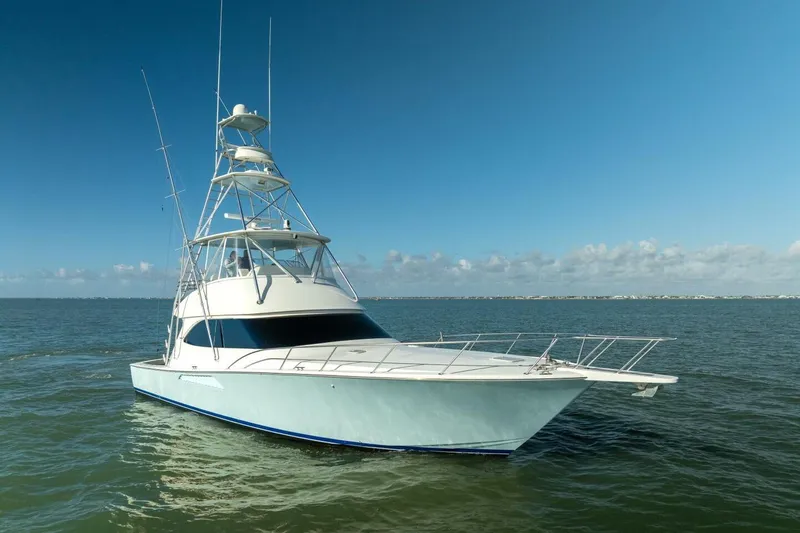 Stay Salty Yacht Photos Pics 2009 Viking 50 Convertible yacht cruising on open water under clear skies.