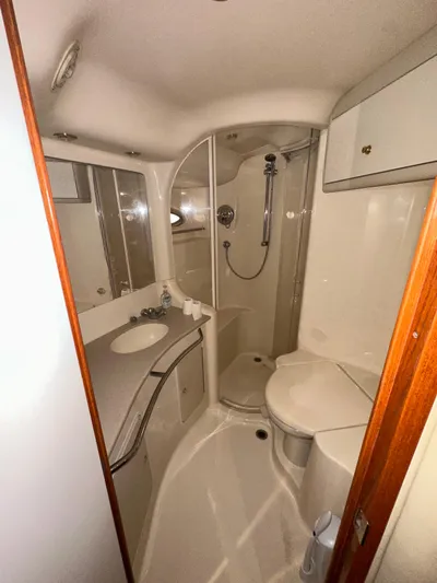  Yacht Photos Pics 2001 Sea Ray 480 Sedan Bridge bathroom with shower, sink, and storage cabinets.