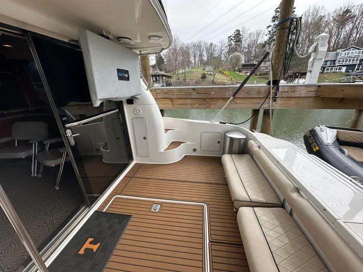  Yacht Photos Pics 2001 Sea Ray 480 Sedan Bridge yacht deck with seating and water view.