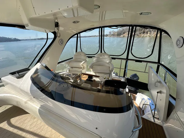  Yacht Photos Pics Interior view of 2001 Sea Ray 480 Sedan Bridge yacht with helm and seating.