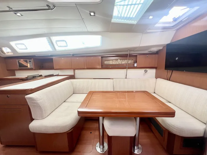 Island Time Ll Yacht Photos Pics Luxurious interior of 2008 Beneteau 46 yacht with elegant seating and dining area.