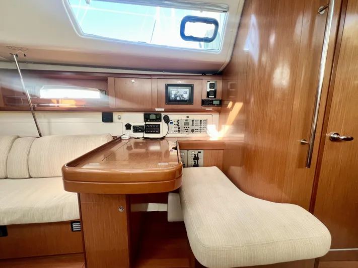 Island Time Ll Yacht Photos Pics Interior of 2008 Beneteau 46 yacht with wooden cabinetry and navigation equipment.