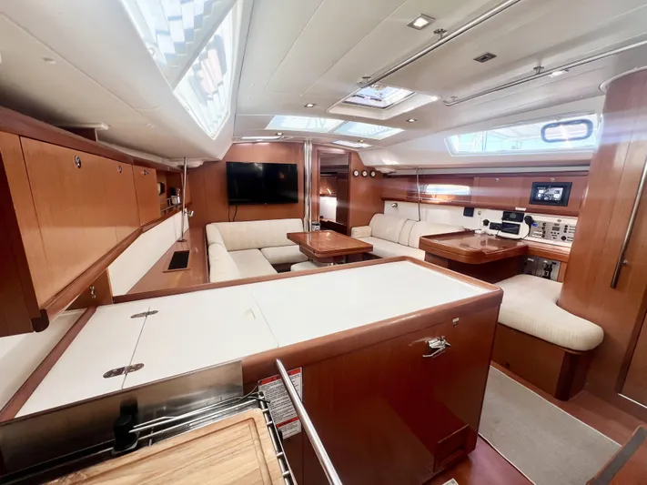 Island Time Ll Yacht Photos Pics Luxurious interior of 2008 Beneteau 46 yacht with modern amenities and elegant wood finish.