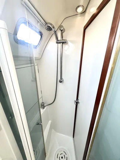 Island Time Ll Yacht Photos Pics Beneteau 46 2008 yacht shower with modern fixtures and natural light.