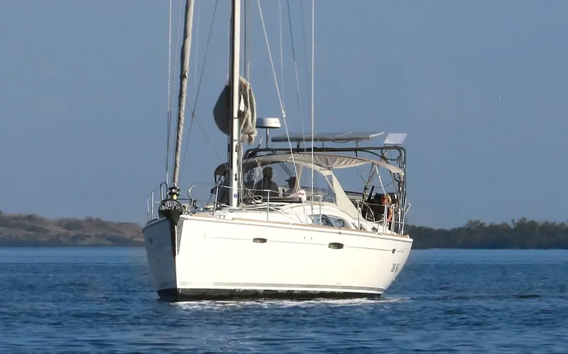 Island Time Ll Yacht Photos Pics 2008 Beneteau 46 sailboat cruising on calm waters under clear skies.