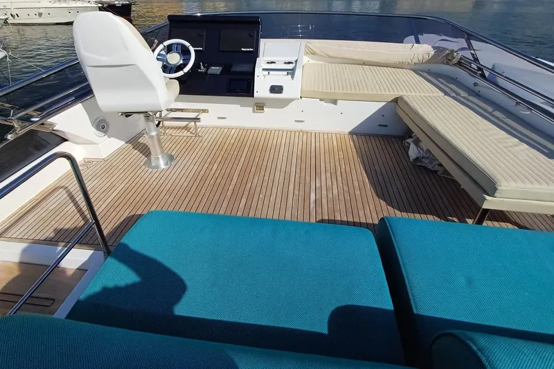  Yacht Photos Pics Luxurious 2018 Azimut 77S yacht deck with seating and steering area.