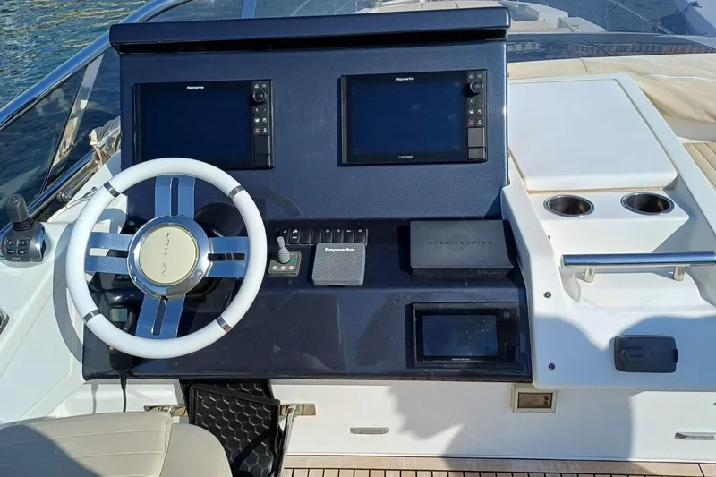  Yacht Photos Pics Cockpit of 2018 Azimut 77S yacht with dual Raymarine displays and Volvo Penta controls.