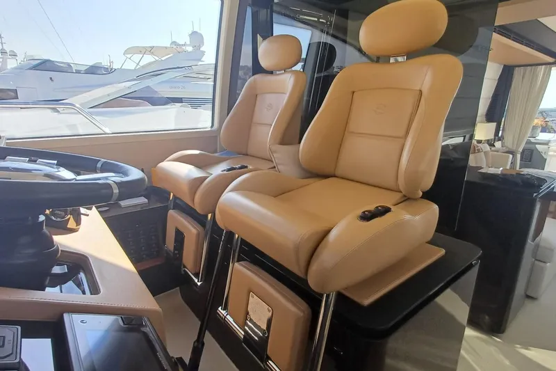  Yacht Photos Pics Luxurious 2018 Azimut 77S yacht interior with plush leather seating and modern helm controls.