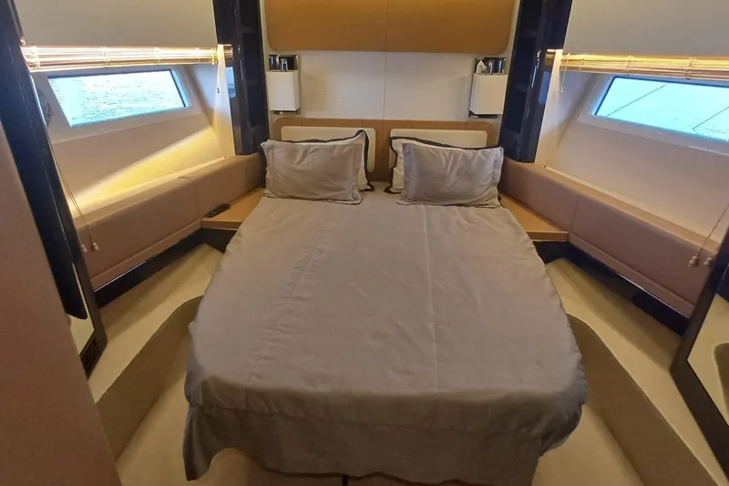  Yacht Photos Pics Luxurious bedroom interior of 2018 Azimut 77S yacht with modern design and cozy bedding.