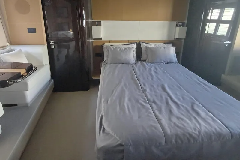  Yacht Photos Pics Luxurious bedroom interior of 2018 Azimut 77S yacht with modern design and comfortable bedding.