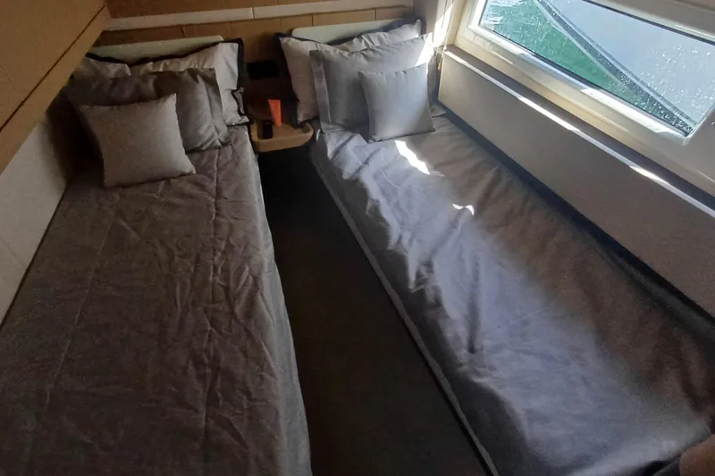  Yacht Photos Pics Interior cabin of 2018 Azimut 77S yacht with twin beds and window view.