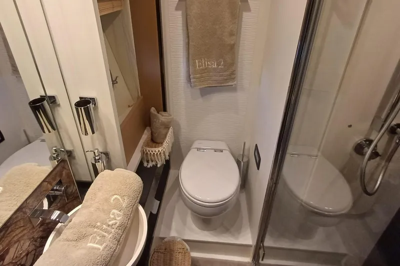  Yacht Photos Pics Luxurious bathroom in 2018 Azimut 77S yacht with modern fixtures and elegant design.