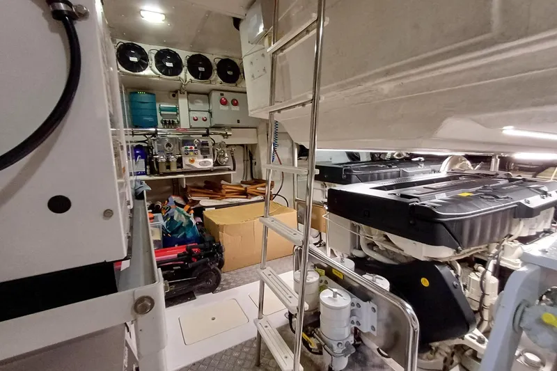  Yacht Photos Pics Engine room of 2018 Azimut 77S yacht, featuring machinery and storage space.