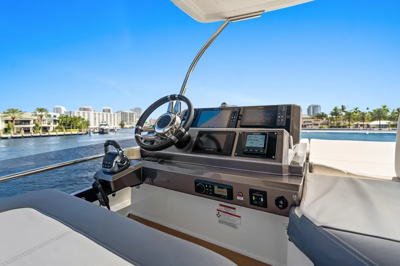  Yacht Photos Pics Helm of 2021 Galeon 500 Fly yacht with modern controls and waterfront view.