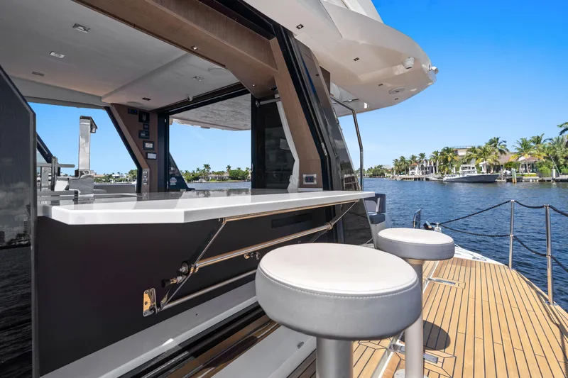  Yacht Photos Pics 2021 Galeon 500 Fly yacht with outdoor bar and stools on deck.