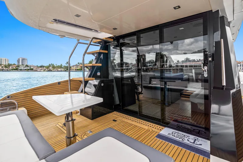  Yacht Photos Pics Luxurious 2021 Galeon 500 Fly yacht deck with modern seating and waterfront view.