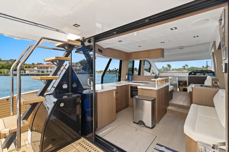  Yacht Photos Pics Luxurious interior of 2021 Galeon 500 Fly yacht with modern kitchen and scenic water view.