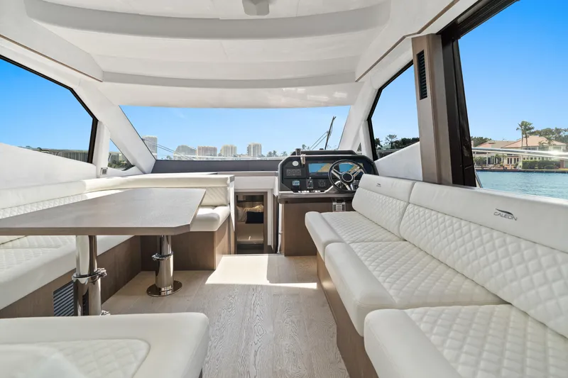  Yacht Photos Pics Luxurious interior of 2021 Galeon 500 Fly yacht with elegant seating and panoramic windows.