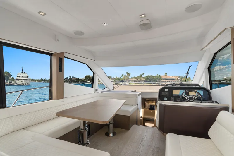  Yacht Photos Pics Interior of 2021 Galeon 500 Fly yacht with elegant seating and helm view.