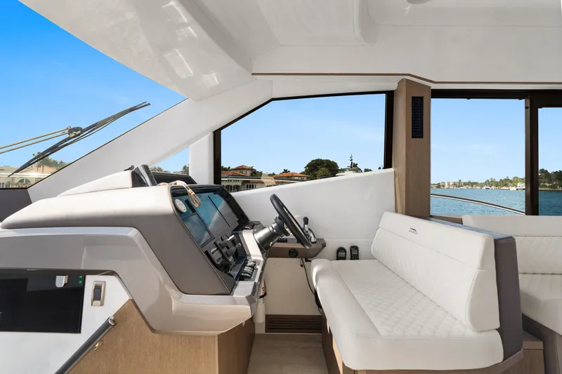  Yacht Photos Pics Interior of 2021 Galeon 500 Fly yacht with modern helm and seating area.