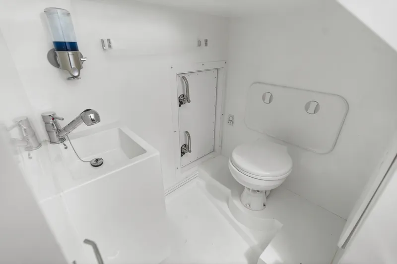  Yacht Photos Pics Modern bathroom in 2021 Galeon 500 Fly yacht, featuring sleek white design and compact fixtures.