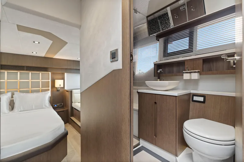  Yacht Photos Pics Luxurious interior of 2021 Galeon 500 Fly yacht featuring bedroom and modern bathroom.