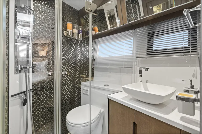  Yacht Photos Pics Luxurious bathroom in 2021 Galeon 500 Fly yacht with modern fixtures and mosaic tiles.