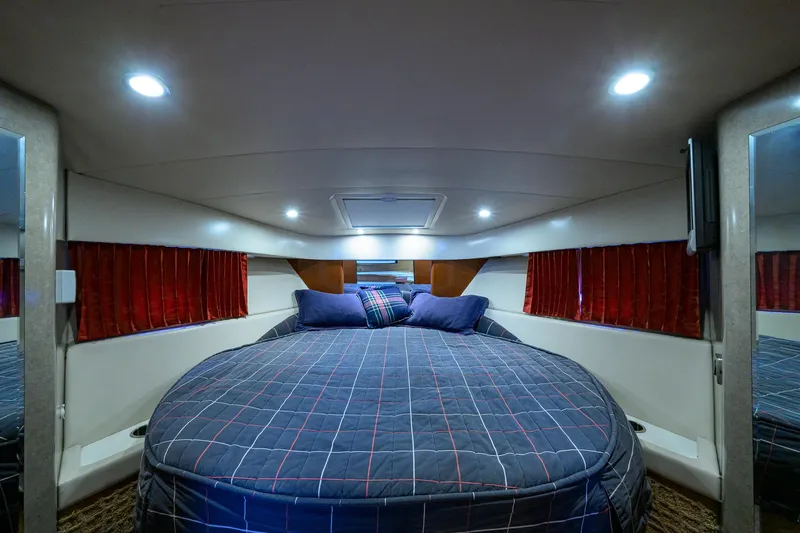 Sababa Yacht Photos Pics Luxurious cabin interior of 2007 Formula 37 PC yacht with cozy bed and ambient lighting.