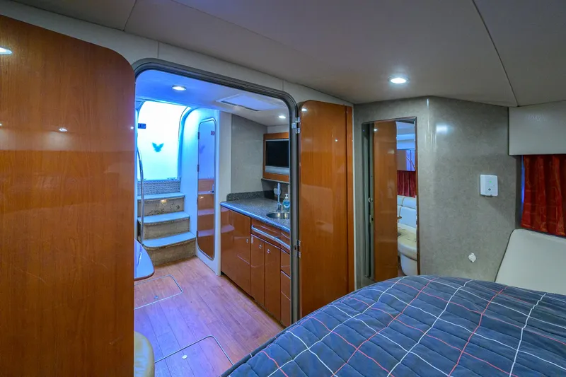 Sababa Yacht Photos Pics Interior of 2007 Formula 37 PC yacht with modern kitchen and cozy bedroom.