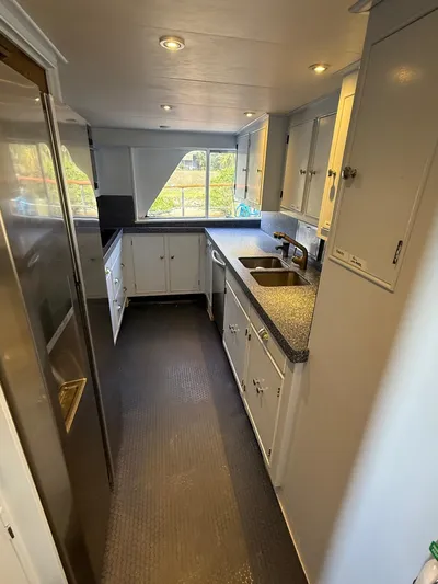 Miss Wendy Yacht Photos Pics 1972 Burger 81 Raised Pilothouse yacht kitchen with modern appliances and ample counter space.