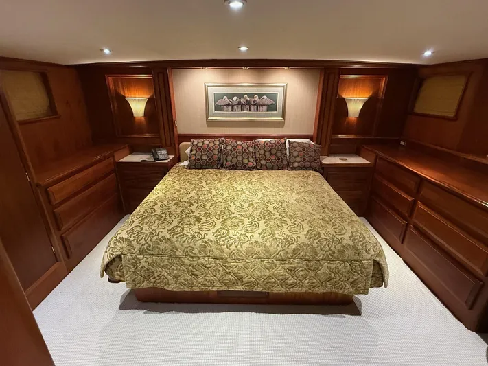 Miss Wendy Yacht Photos Pics Luxurious bedroom in 1972 Burger 81 Raised Pilothouse yacht with elegant wood furnishings.