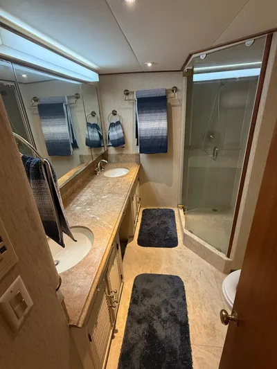 Miss Wendy Yacht Photos Pics Luxurious bathroom in 1972 Burger 81 Raised Pilothouse yacht with dual sinks and glass shower.