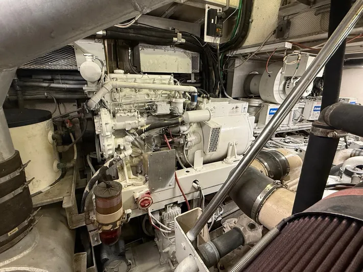 Miss Wendy Yacht Photos Pics Engine room of 1972 Burger 81 Raised Pilothouse yacht, showcasing mechanical components.