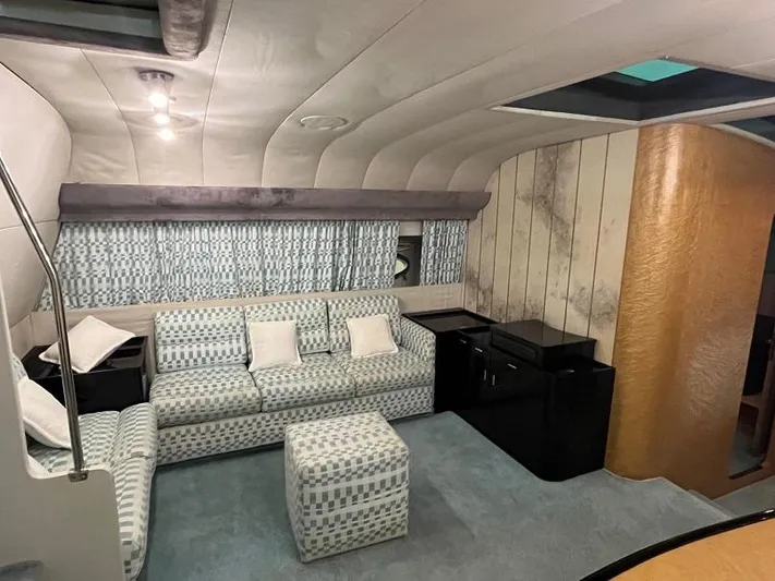  Yacht Photos Pics Interior of 1989 Riva 60 Black Corsair yacht with patterned seating and modern decor.