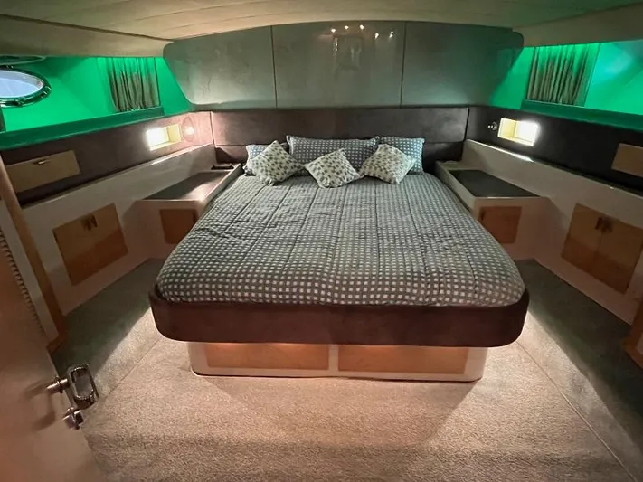  Yacht Photos Pics Luxurious cabin interior of a 1989 Riva 60 Black Corsair yacht with a spacious bed.