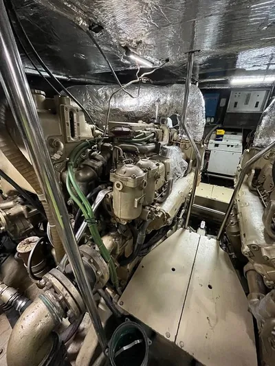  Yacht Photos Pics Engine room of a 1989 Riva 60 Black Corsair yacht, showcasing complex machinery and wiring.