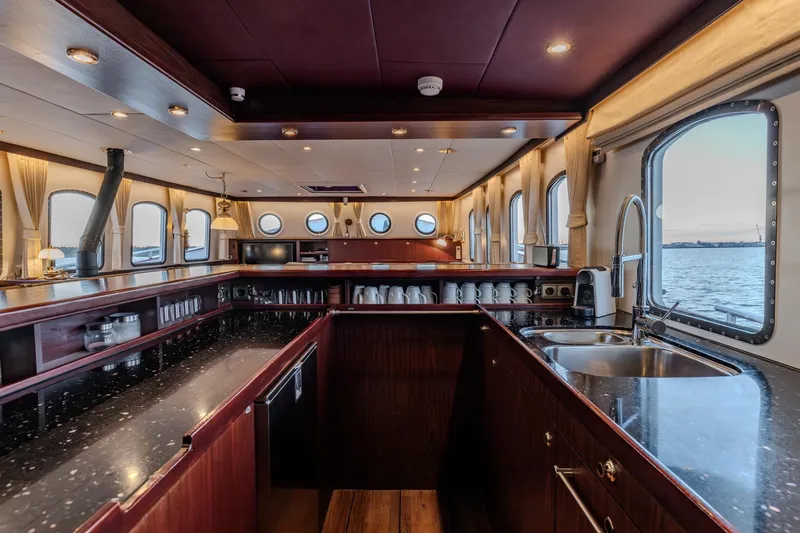 San Gottardo Yacht Photos Pics Luxurious 2009 Altena Expedition yacht interior with elegant kitchen and ocean view.