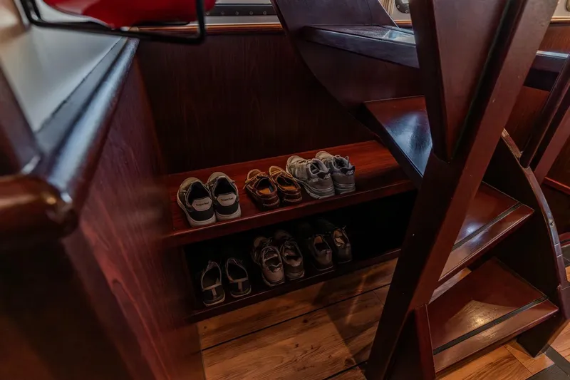 San Gottardo Yacht Photos Pics Wooden interior of 2009 Altena Expedition with shoe storage under stairs.