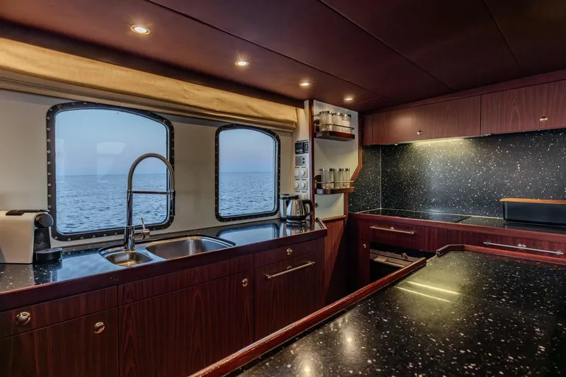 San Gottardo Yacht Photos Pics Luxurious kitchen interior of 2009 Altena Expedition yacht with ocean view.