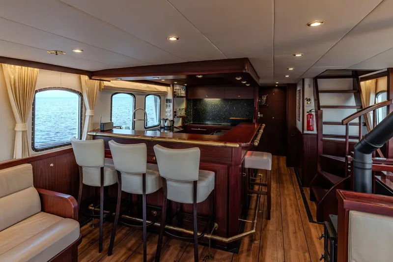 San Gottardo Yacht Photos Pics Luxurious interior of 2009 Altena Expedition yacht with elegant bar and seating area.