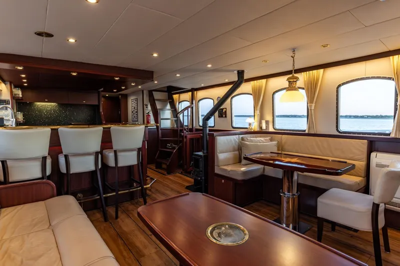 San Gottardo Yacht Photos Pics Luxurious interior of 2009 Altena Expedition yacht with elegant seating and dining area.