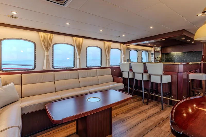 San Gottardo Yacht Photos Pics Luxurious interior of 2009 Altena Expedition yacht with elegant seating and bar area.