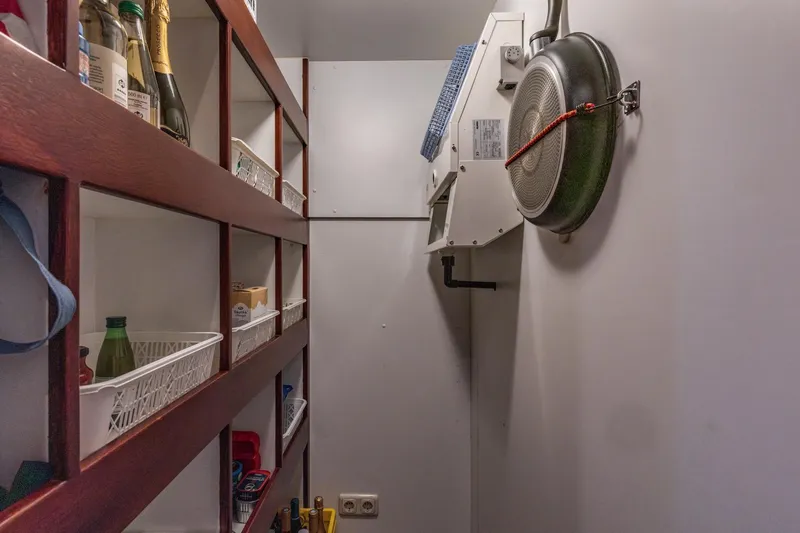 San Gottardo Yacht Photos Pics Storage area in a 2009 Altena Expedition yacht with shelves and equipment.