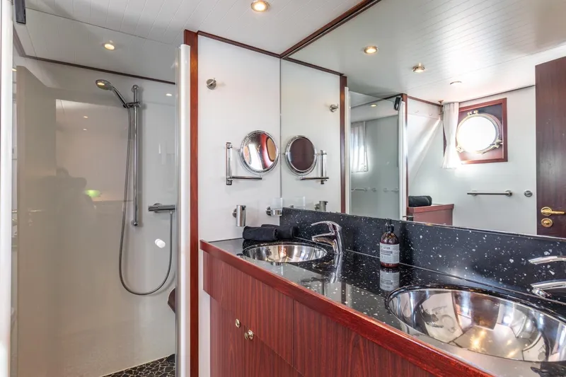 San Gottardo Yacht Photos Pics Luxurious bathroom in 2009 Altena Expedition yacht with dual sinks and modern shower.