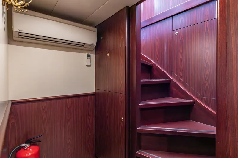 San Gottardo Yacht Photos Pics Interior of 2009 Altena Expedition yacht with wooden stairs and air conditioning unit.