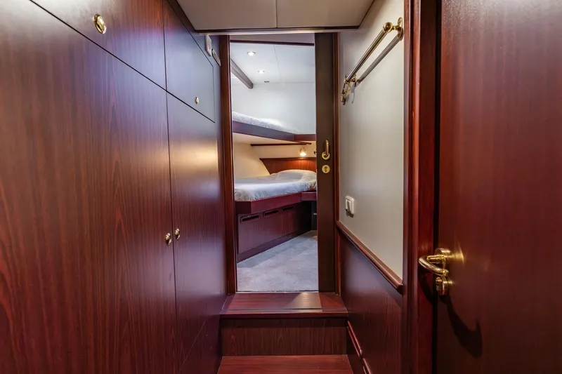 San Gottardo Yacht Photos Pics Luxurious wooden interior of 2009 Altena Expedition yacht cabin with bunk beds.