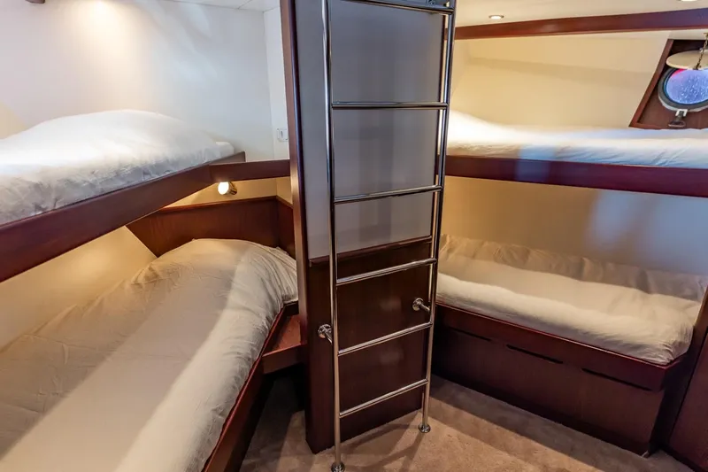 San Gottardo Yacht Photos Pics 2009 Altena Expedition yacht cabin with four cozy bunk beds and modern lighting.